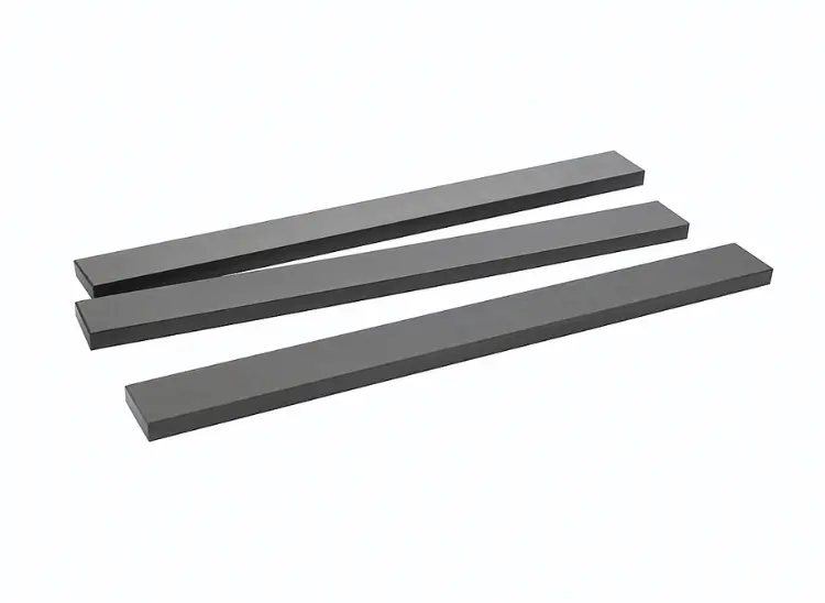 Three durable rectangular tungsten carbide bars, used as industrial wear parts or flat stock in heavy-duty machinery.