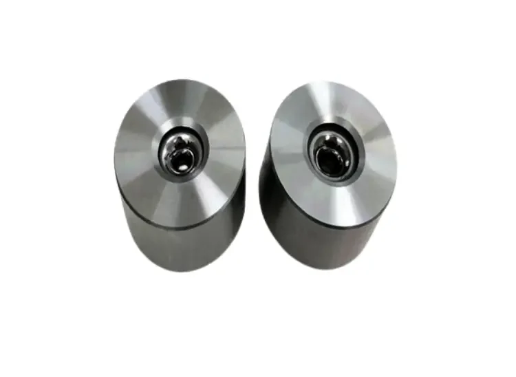 Two cased tungsten carbide wire drawing dies with polished insert cores for reducing metal wire.
