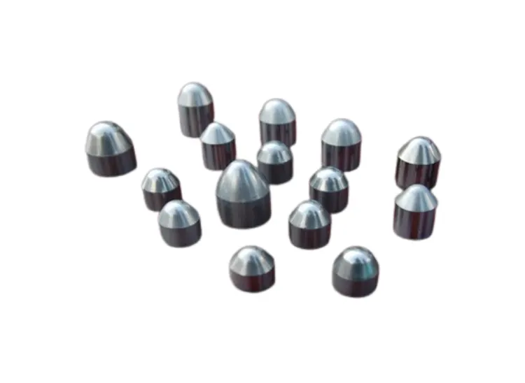 A group of approximately fifteen two-tone conical tungsten carbide tips.