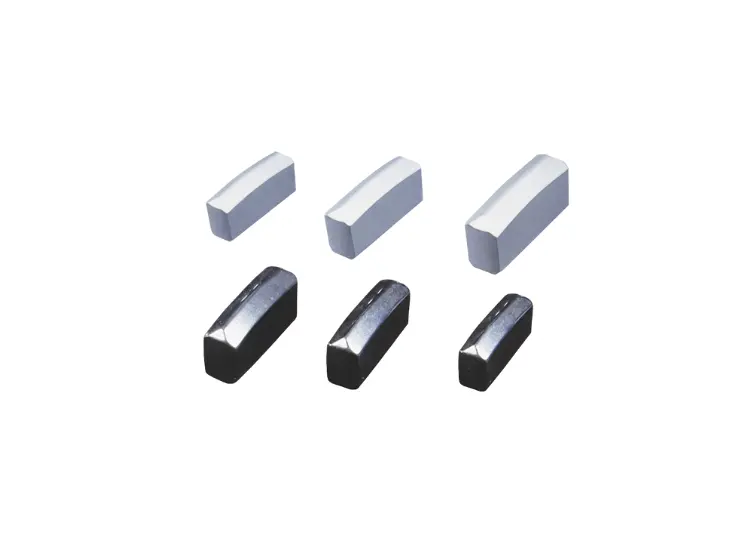 Detailed image of four conical tungsten carbide tools used for roller bits and mining equipment.